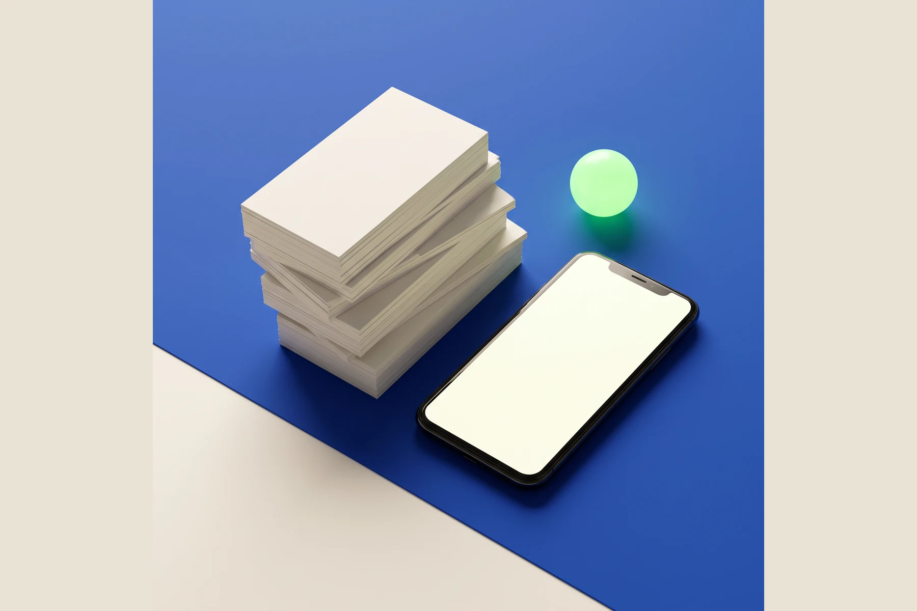 Phone and a stack of blank paper on a cobalt surface